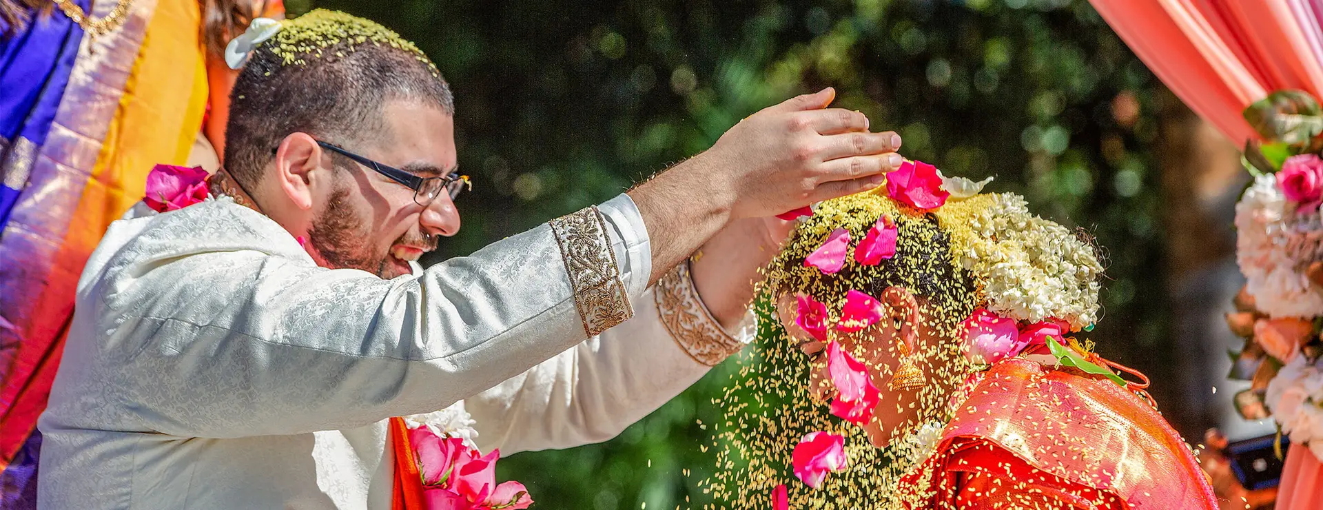 Indian wedding photographer capturing bride and groom during traditional ceremony